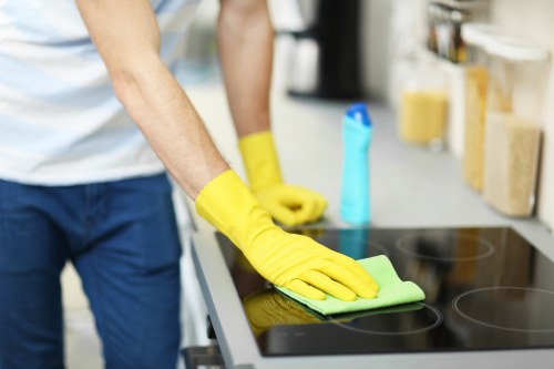 Cleaning technician treating a stained mattress in a local flat